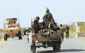 Afghan National Army soldiers arrive to start an operation soon, outside of Kunduz city, north of Kabul, Afghanistan, Wednesday, Sept. 30, 2015. The U.S. military says it has conducted two more airstrikes overnight on Taliban positions around a northern Afghan city seized by the insurgents this week. (Najim Rahim via AP)