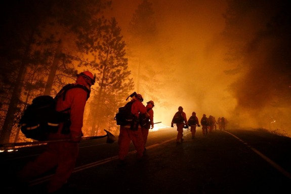 Fire fighters in California march into the blaze, putting their lives on the line to protect their fellow Americans this summer