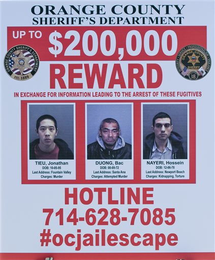 A wanted sign is displayed for the The reward for information leading to the arrest of the the three escaped inmates from the Orange County Central Men's Jail on Tuesday, Jan. 26, 2016, in Santa Ana, Calif. (Paul Rodriguez/The Orange County Register via AP) MAGS OUT; LOS ANGELES TIMES OUT; MANDATORY CREDIT