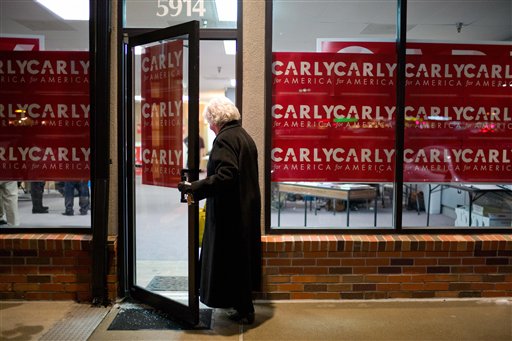 Volunteer Janet Frank enters a campaign office for Republican presidential candidate Carly Fiorina, Wednesday, Jan. 6, 2016, in West Des Moines, Iowa. (AP Photo/Jae C. Hong)