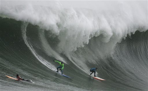 FILE - In this Jan. 12, 2008, file photo, Greg Long, left, and Jamie Sterling surf a giant wave during the Mavericks surf contest in Half Moon Bay, Calif. The world's best big-wave competition, Titans of Mavericks has been set for Friday, Feb. 12, 2016. Mavericks is the world's premiere, high adrenaline, big wave surfing event is a one-day invitation-only surfing competition that is held at the legendary Mavericks surf break located near Half Moon Bay, about 20 miles south of San Francisco. (AP Photo/Ben Margot)
