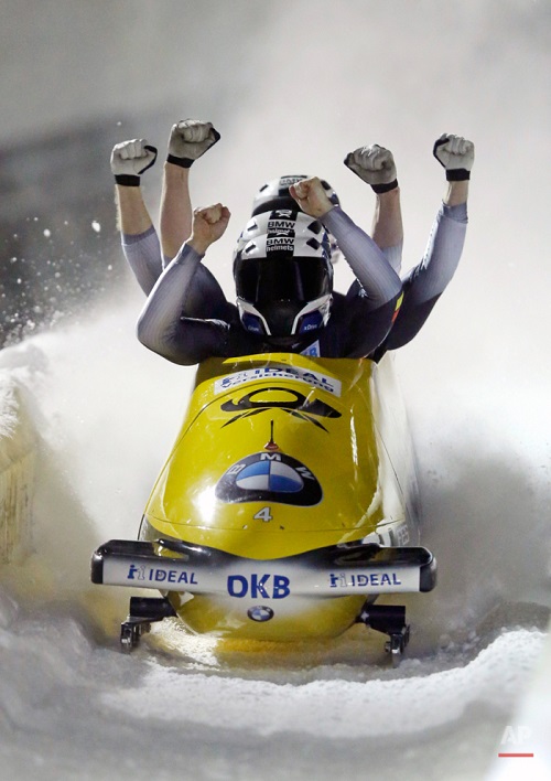 Driver Nico Walther, foreground, with Marko Huebenbecker, Christian Poser and Eric Franke, of Germany, celebrates after winning the four-man bobsled World Cup race on Saturday, Jan. 16, 2016, in Park City, Utah. (AP Photo/Rick Bowmer)