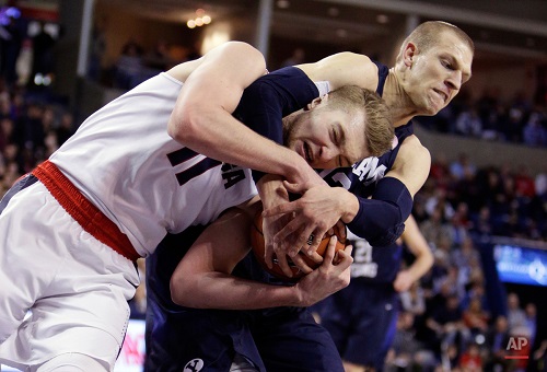 Gonzaga's Domantas Sabonis (11) and BYU's Nate Austin go after a rebound during the first half of an NCAA college basketball game, Thursday, Jan. 14, 2016, in Spokane, Wash. (AP Photo/Young Kwak)
