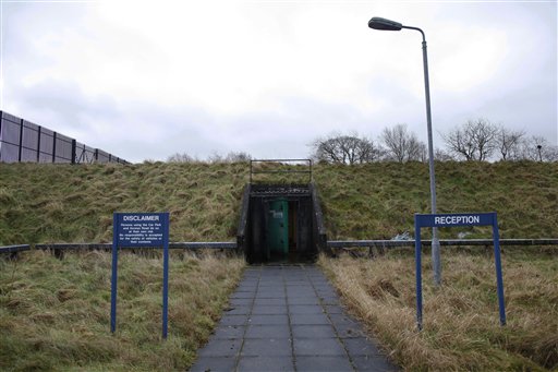 The entrance to the nuclear bunker that was built by the during the cold war in Ballymena, Northern Ireland, Thursday, Feb. 4, 2016. Northern Ireland is selling its Cold War-era nuclear bunker, an underground installation with room for 235 beds that sellers imagine could be transformed into a tourist attraction or blast-proof storage facility. Journalists took a tour Thursday of Northern Irelands strangest real estate offering. For 575,000 pounds ($850,000), the successful buyer could acquire a 46,363-square-foot (4,300-square-meter) grass-topped building discretely situated on 3.74 acres (1.51 hectares) of rolling grassland northwest of Belfast. (AP Photo/Peter Morrison)