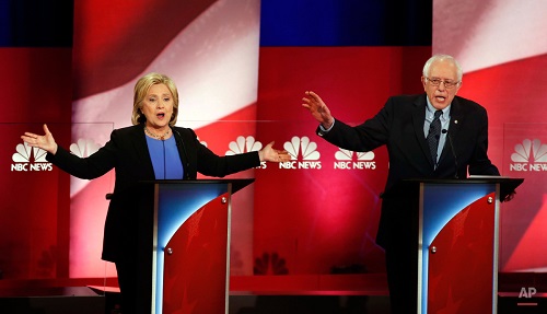 Democratic presidential candidates, former Secretary of State Hillary Clinton, left, and Sen. Bernie Sanders, I-Vt., talk over each other during the democratic presidential primary debate at the Gaillard Center, Sunday, Jan. 17, 2016, in Charleston, S.C. (AP Photo/Mic Smith)