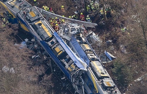 Aerial view of rescue forces working at the site of the train accident.(Peter Kneffel/dpa via AP)