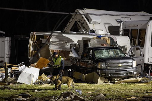 First responders search the remains of trailers and vehicles after a suspected tornado hit the Sugar Hill RV Park in Convent, La., Tuesday, Feb. 23, 2016. (AP Photo/Max Becherer)