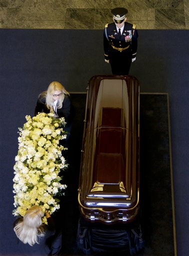 Flowers are placed on the casket of Nancy Reagan at the Ronald Reagan Presidential Library, Wednesday, March 9, 2016 in Simi Valley, Calif. (AP Photo/Jae C. Hong, Pool)