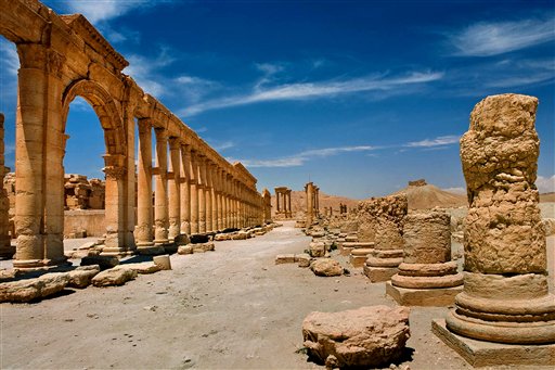In this undated photo released by the Syrian official news agency SANA, shows the site of the ancient city of Palmyra, Syria. Palmyra is an archaeological gem that Syrian troops took back from Islamic State fighters on Sunday, March 27, 2016. Syrian state media and an opposition monitoring group say government forces backed by Russian airstrikes have driven Islamic State fighters from the historic central town of Palmyra, held by the extremists since May. (SANA via AP)