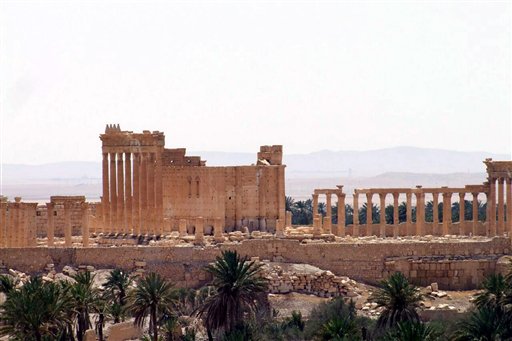 FILE -- This file photo released May 17, 2015, by the Syrian official news agency SANA, shows a general view of Palmyra, Syria. Palmyra is an archaeological gem that Syrian troops took back from Islamic State fighters, Sunday, March 27, 2016. A desert oasis surrounded by palm trees in central Syria, Palmyra is also a strategic crossroads linking the Syrian capital, Damascus with the country's east and neighboring Iraq. Home to 65,000 people before the latest fighting, the town is located 155 miles (215 kilometers) east of Damascus. (SANA via AP, File)