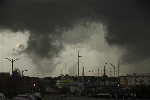A storm passes over north Tulsa, Okla., Wednesday, March 30, 2016. Multiple people were injured and authorities were evaluating the damage in northeastern Oklahoma after severe storms spawned multiple tornado touchdowns Wednesday night, authorities said. (James Gibbard/Tulsa World via AP) ONLINE OUT; KOTV OUT; KJRH OUT; KTUL OUT; KOKI OUT; KQCW OUT; KDOR OUT; TULSA OUT; TULSA ONLINE OUT; MANDATORY CREDIT