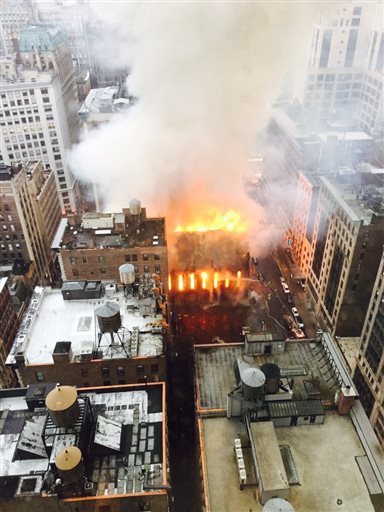 Firefighters battle flames at an historic Serbian Orthodox Cathedral of St. Sava in New York, Sunday, May 1, 2016. The church was constructed in the early 1850s and was designated a New York City landmark in 1968. (Anindya Ghose via AP) MANDATORY CREDIT
