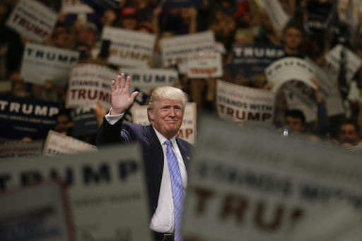Republican presidential candidate Donald Trump waves to the crowd as he arrives at a rally at the Anaheim Convention Center, Wednesday, May 25, 2016, in Anaheim, Calif. (AP Photo/Jae C. Hong)