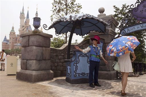 A visitor walks into the Alice in Wonderland maze on the eve of the opening of the Disney Resort in Shanghai, China, Wednesday, June 15, 2016. Disney will open its first resort in mainland China on Thursday. (AP Photo/Ng Han Guan)