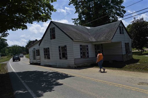 A home carried by flash flood waters sits in the middle of a road in Rupert, W.Va., Sunday, June 26, 2016. (Christian Tyler Randolph/Charleston Gazette-Mail via AP) MANDATORY CREDIT