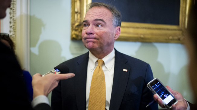 UNITED STATES - NOVEMBER 18: Sen. Tim Kaine, D-Va., talks with reporters outside of the senate luncheons in the Capitol, November 18, 2014. (Photo By Tom Williams/CQ Roll Call) (CQ Roll Call via AP Images)
