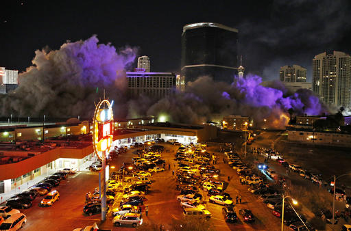 Smoke covers the area after The Monaco Tower at the Riviera Hotel and Casino crumbled to the ground during a controlled demolition, Tuesday, June 14, 2016, in Las Vegas. The casino opened in 1955 and was closed last year to make room to expand the Las Vegas Convention Center. (AP Photo/John Locher)