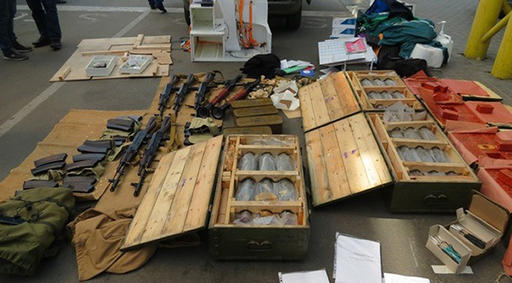 In this image, provided by the Ukrainian Intelligence Agency SBU on Monday, June 6, 2016, confiscated ammunition and explosives are on a display at the Yahodyn border crossing on the Ukrainian-Polish border, Ukraine. Ukraine's intelligence agency SBU said on Monday it has thwarted a plot to attack soccer's European Championships in France by arresting a Frenchman who wanted to cross from Ukraine into the European Union armed to the teeth. (Ukraine's Intelligence Agency SBU Press Service photo via AP)