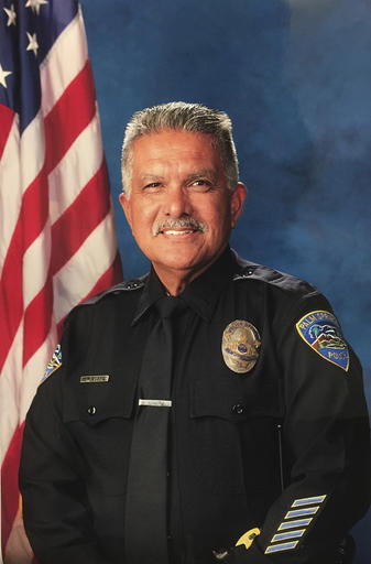 In this photo released by the Palm Springs Police Department shows slain officer Jose "Gil" Gilbert Vega, a 35 year veteran who was killed in the line of duty Saturday, Oct. 8, 2016. Vega, the father of eight, planned to retire in December. (Palm Springs Police Department via AP)