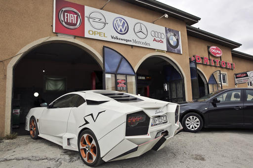 Kosovo car enthusiast Driton Selmani parks his hand made replica of a Lamborghini outside his workshop in the town of Gjilan on Thursday, Oct. 27, 2016. Selmani always wanted some hot wheels but could not afford them. What he had, however, was a workshop and talent for bending and welding metal. so he built himself a Lamborghini. (AP Photo/Visar Kryeziu)