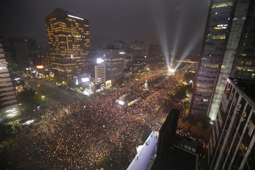 In this Saturday, Nov. 5, 2016 photo, South Korean protesters stage a rally calling for South Korean President Park Geun-hye to step down in downtown Seoul, South Korea. South Korea is seeing its biggest wave of street demonstrations in decades but nobody is sure how many people are taking to the streets each week. At first media relied on two sources - the police and the organizer. But they have been accused of underestimating or overestimating the crowds in the previous four Saturdays (AP Photo/Ahn Young-joon, File)