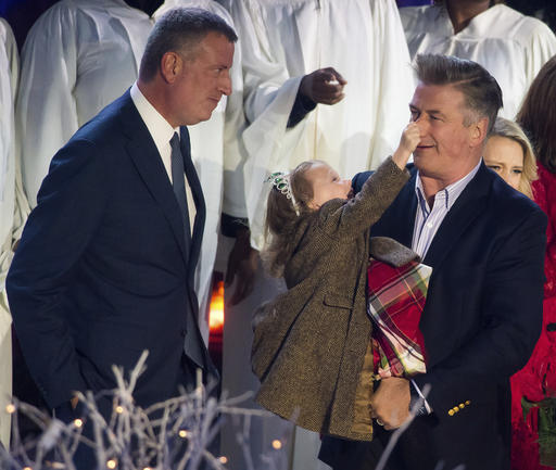 Mayor Bill de Blasio, left, Carmen Baldwin and Alec Baldwin attend the 84th Annual Rockefeller Center Christmas Tree lighting ceremony on Wednesday, Nov. 30, 2016, in New York. (Photo by Charles Sykes/Invision/AP)